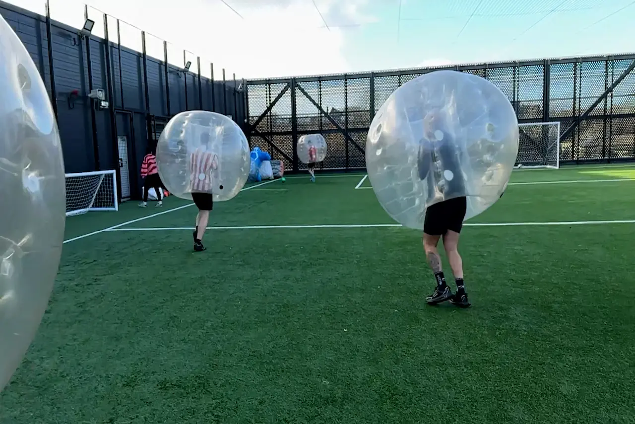 Bubble football players wearing inflatable body zorbs